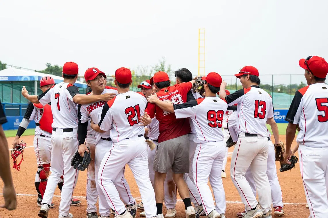 The men's softball national team from Singapore celebrate after they defeated two-time world champions Australia at the World Games on Aug 6 


Credit : Matthew Lim