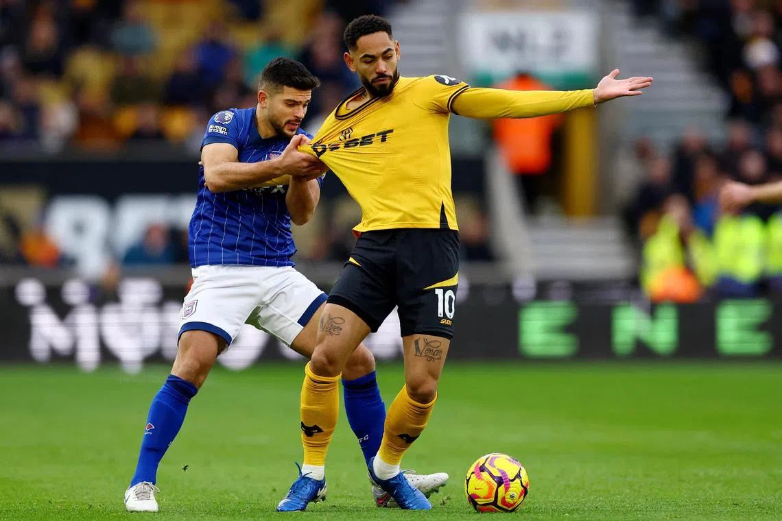 Wolverhampton Wanderers' Matheus Cunha in action (right) on Dec 14 with Ipswich Town's Sam Morsy.