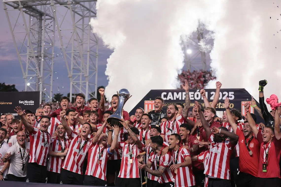 Estudiantes players celebrate winning the Champions Trophy final against Club Atletico Platense at the Unico de San Nicolas stadium in Argentina on Dec 20, 2025.