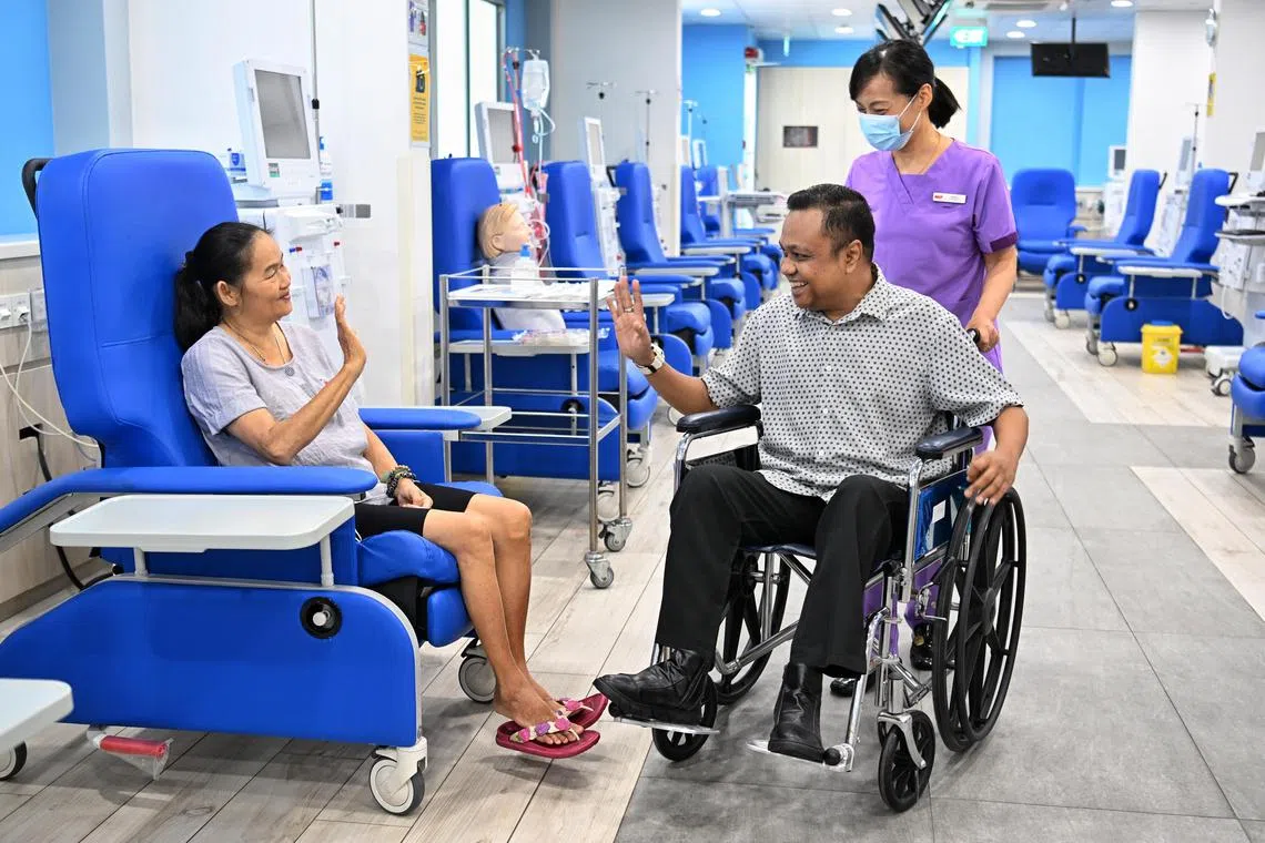 ST20230514_202367883828 jlnkf14 Chong Jun Liang / Joyce Lim /
From left: Patients Mao Fook Ching and Mohamed Hiswady exchange greetings at the NKF dialysis centre at Blk 105 Bedok North Ave 4 on May 14, 2023