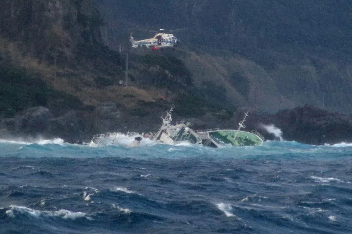 A helicopter conducting a rescue operation after a ship lost power and drifted ashore on Kozushima Island, south of Tokyo. One person was missing and 24 others were rescued after their fishing boat lost power and drifted onto rocks in rough seas off Japan.