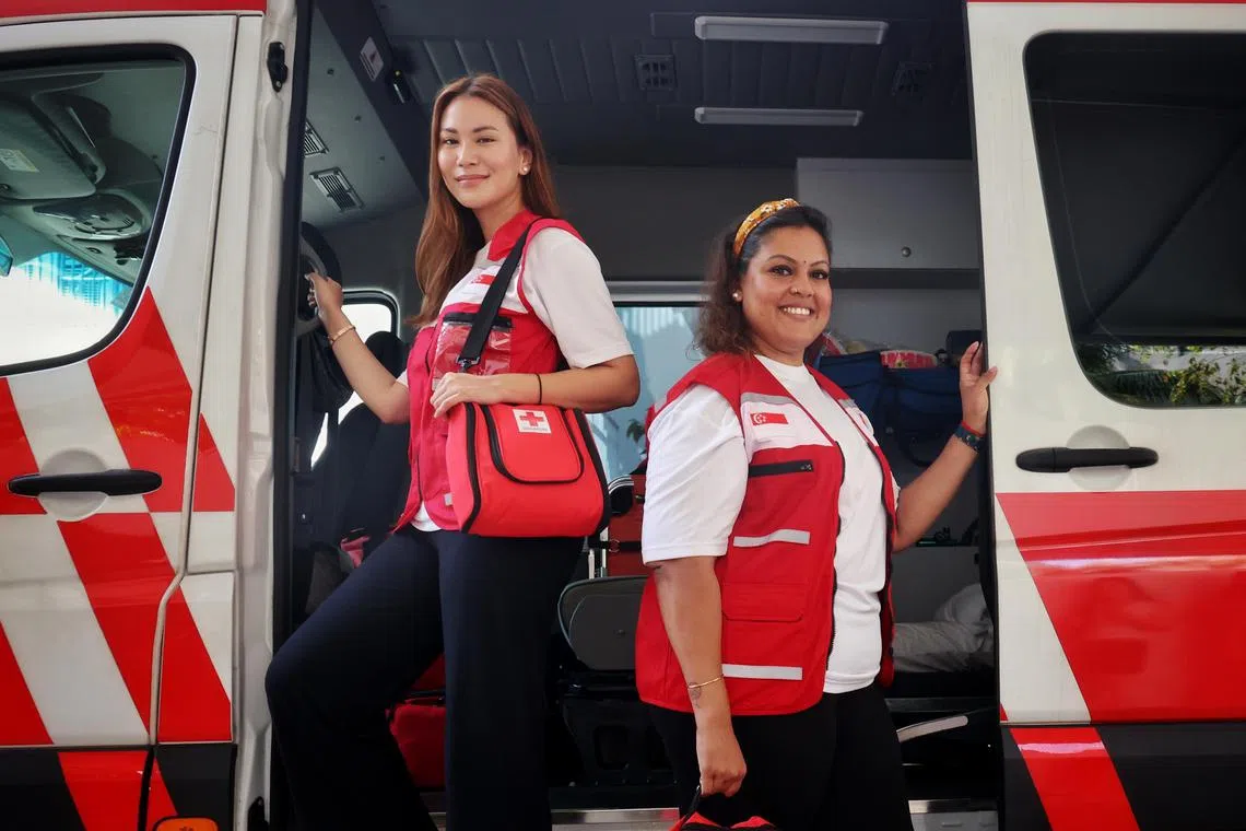 (From left) Singapore Red Cross volunteers Anisa Famy and Gayatri Murugasan, who are both nurses, choose to accompany foreign workers on their journey home as they want to help reunite families.