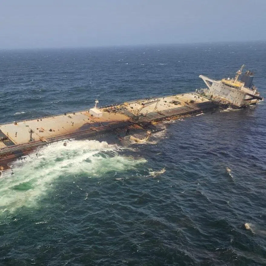 The damaged and half-sunk oil tanker Caroline Bezengi off the coast of Oman.