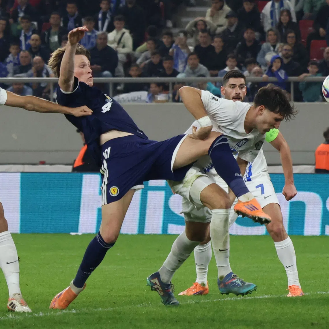 Soccer Football - FIFA World Cup - UEFA Qualifiers - Group C - Greece v Scotland - Karaiskakis Stadium, Piraeus, Greece - November 15, 2025 Scotland's Scott McTominay in action with Greece's Panagiotis Retsos REUTERS/Louiza Vradi
