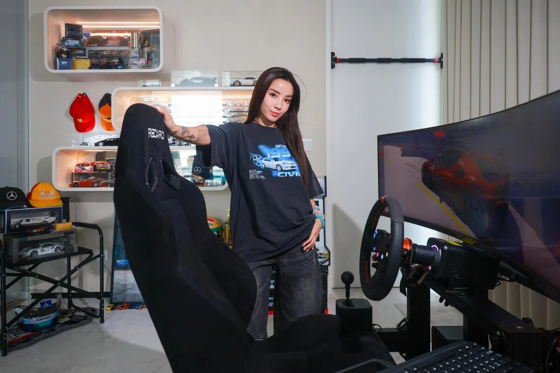 Naomi Neo with her racing car simulator in her home.