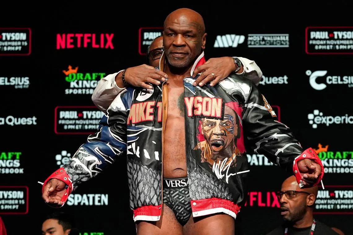 US boxer Mike Tyson takes part in a weigh-in ahead of his heavyweight boxing fight against Jake Paul.