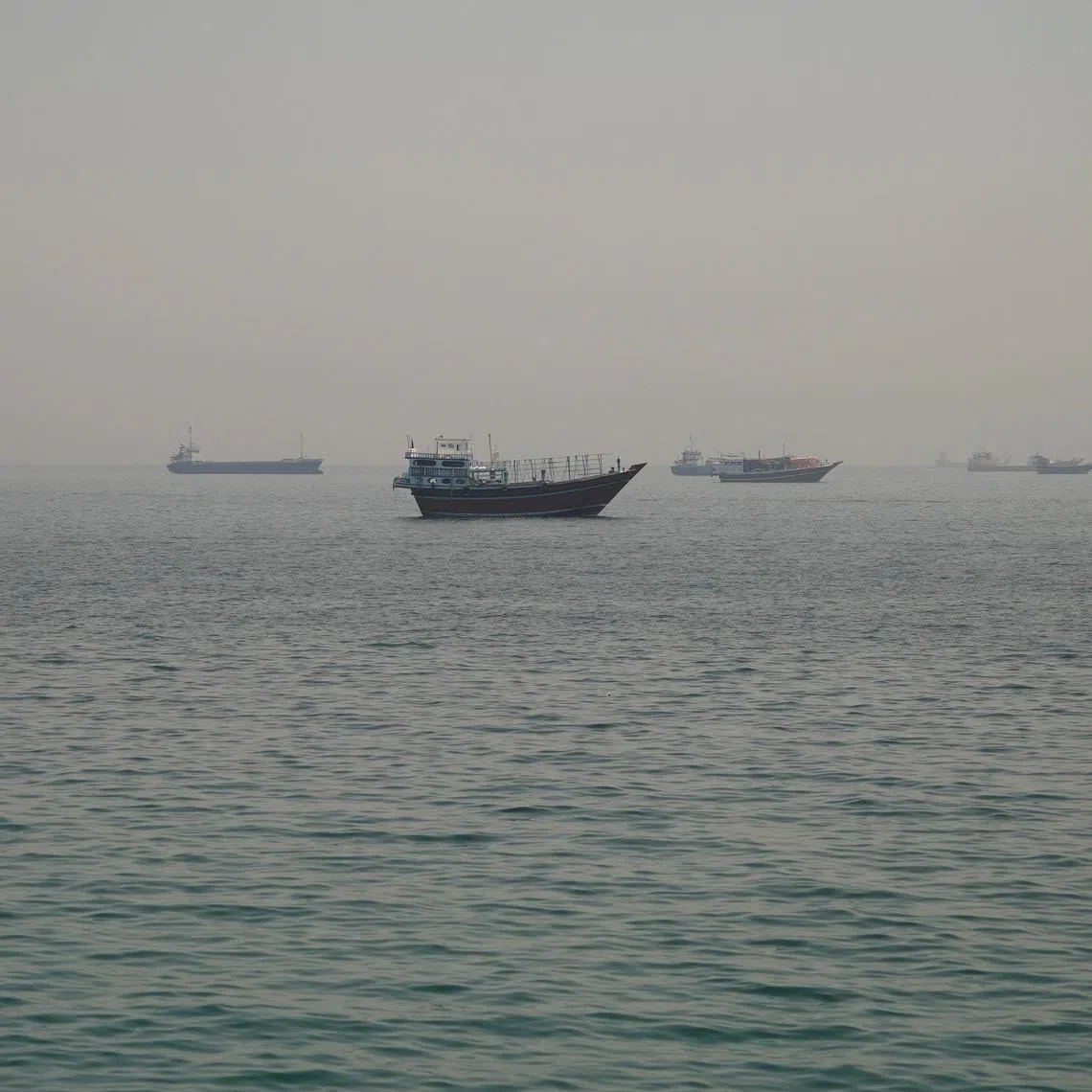Vessels are anchored in the Strait of Hormuz, as seen from Musandam, Oman, June 11, 2026. REUTERS/Stringer
