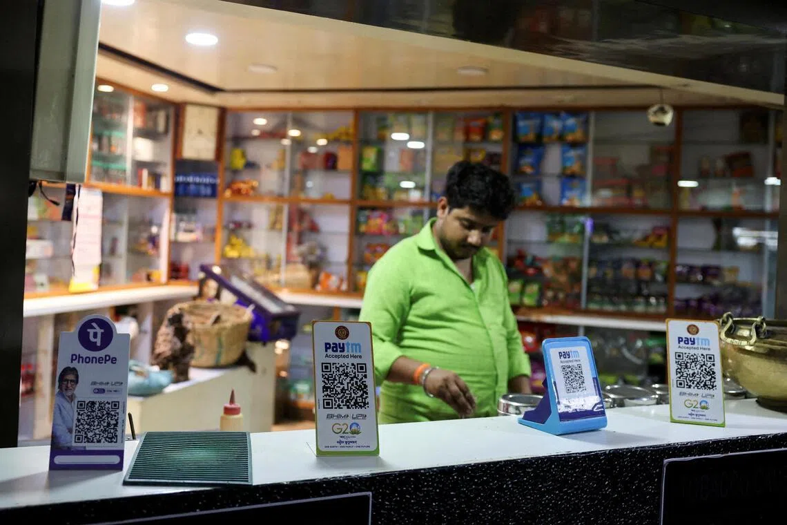 QR codes for digital payment at a grocery store in Ahmedabad in 2024. India has emerged as the second-largest e-retail market after China by number of shoppers. 