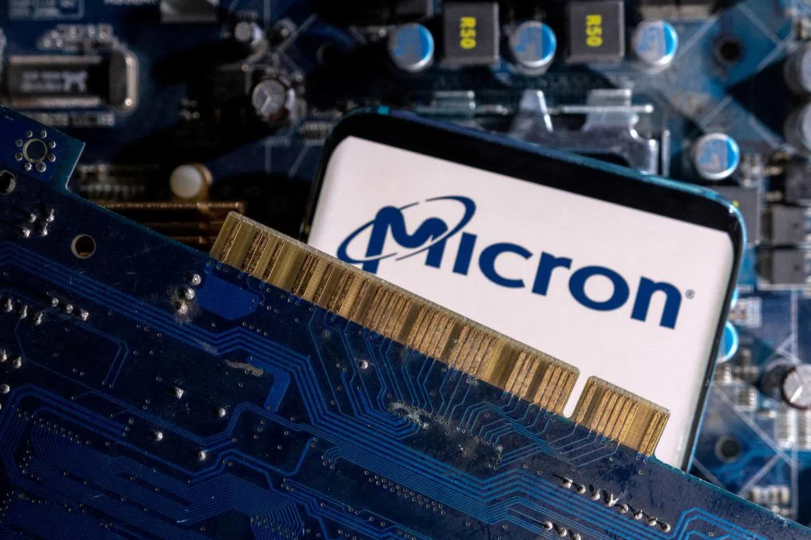  A smartphone with a displayed Micron logo is placed on a computer motherboard in this illustration taken March 6, 2023. REUTERS/Dado Ruvic/Illustration/File Photo