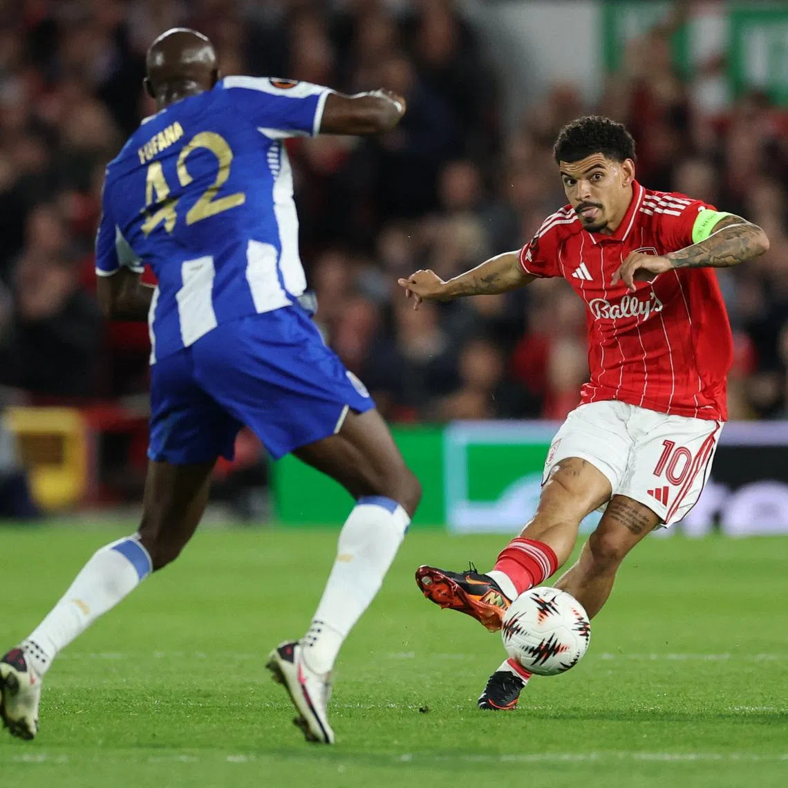 Soccer Football - UEFA Europa League - Quarter Final - Second Leg - Nottingham Forest v FC Porto - The City Ground, Nottingham, Britain - April 16, 2026 FC Porto's Seko Fofana in action with Nottingham Forest's Morgan Gibbs-White Action Images via Reuters/Andrew Boyers