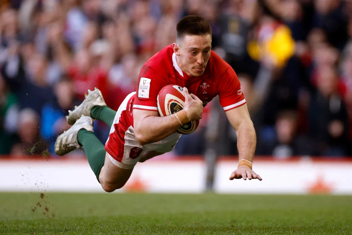 Rugby Union - Six Nations Championship - Wales v Italy - Principality Stadium, Cardiff, Wales, Britain - March 19, 2022 Wales' Josh Adams scores their third try Action Images via Reuters/John Sibley