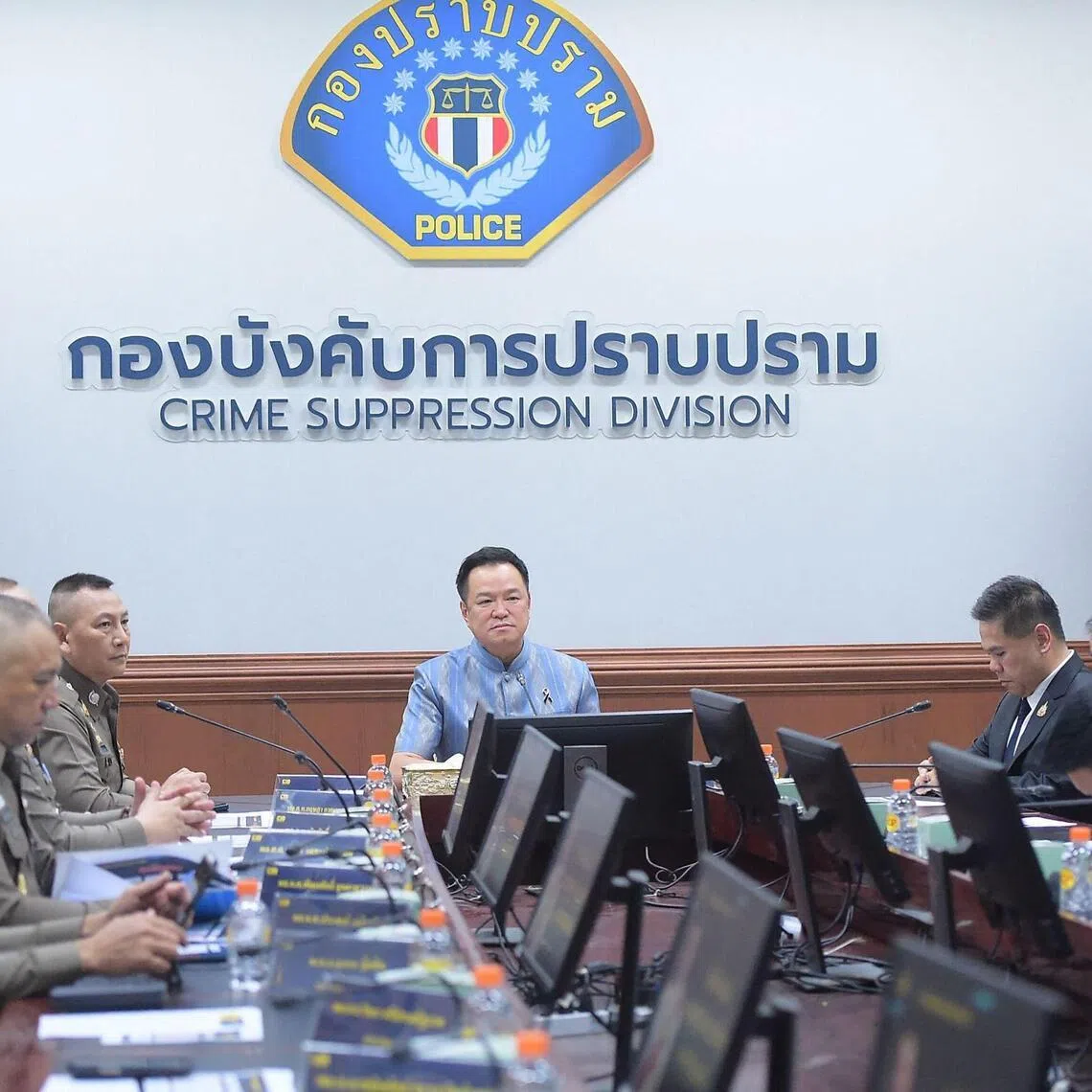 Thai Prime Minister Anutin Charnvirakul (centre) chairing a meeting on an investigation into a local government exam cheating scandal on July 15.