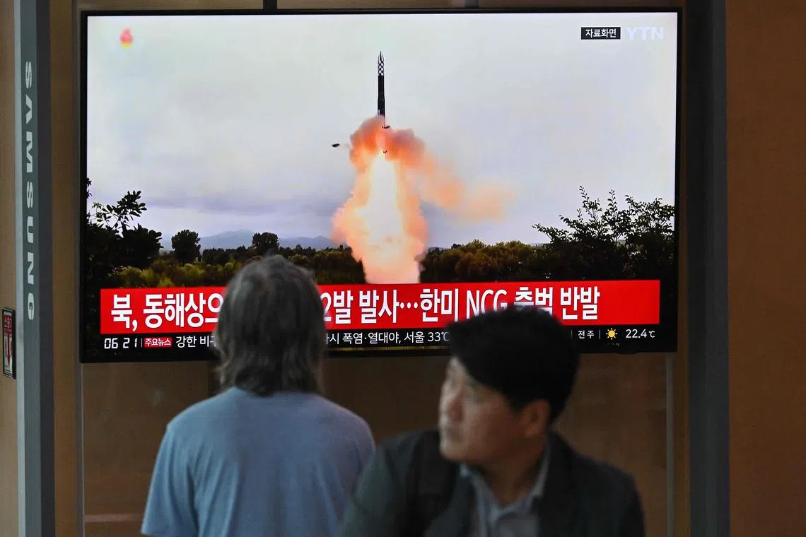 A news broadcast with file footage of a North Korean missile test, at a railway station in Seoul on July 19, 2023. 