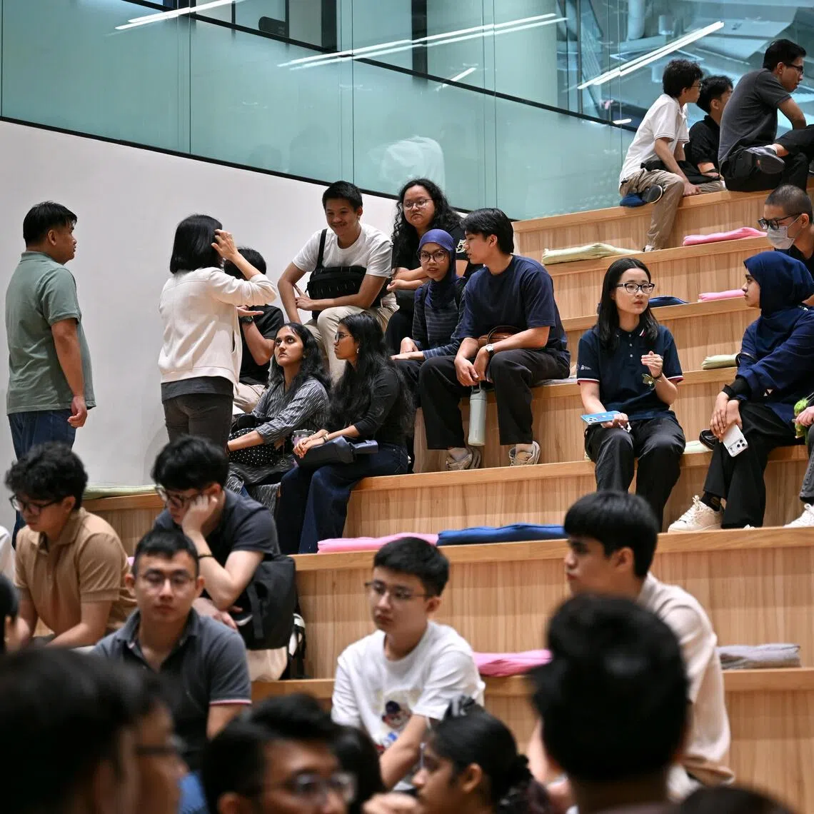 Students going though the human career library segment and the experience centre during a job taster session hosted by GovTech.