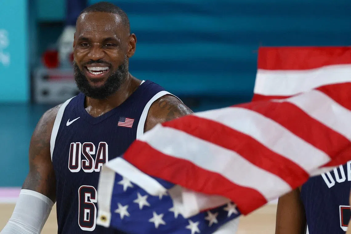 FILE PHOTO: Paris 2024 Olympics - Basketball - Men's Gold Medal Game - France vs United States - Bercy Arena, Paris, France - August 10, 2024. Lebron James of United States celebrates after United States win gold. REUTERS/Stephanie Lecocq/File Photo
