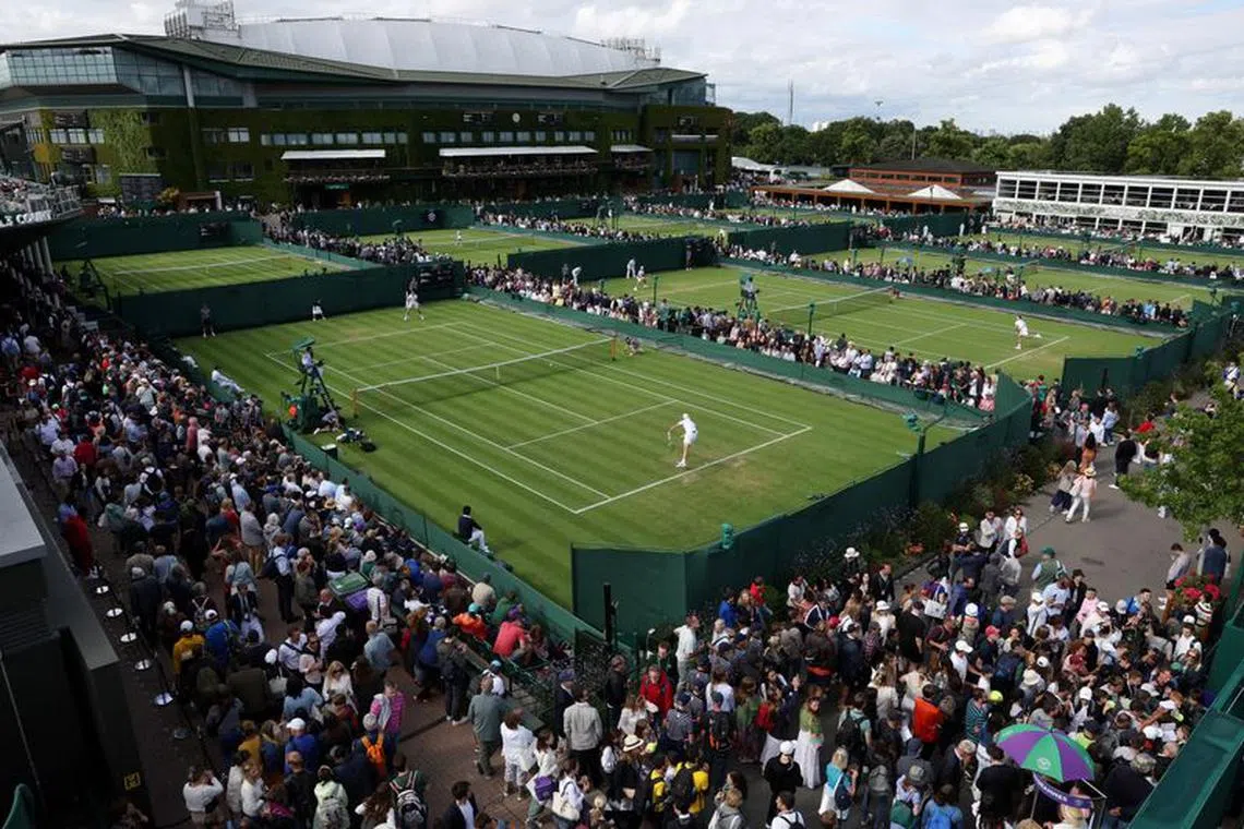 FILE PHOTO: Tennis - Wimbledon - All England Lawn Tennis and Croquet Club, London, Britain - June 27, 2022 General view of the outside courts during play REUTERS/Paul Childs/File Photo