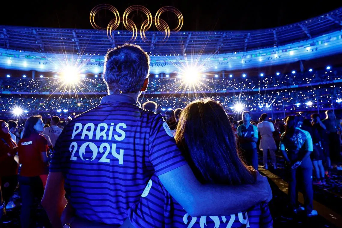 Athletes and the Olympic rings are pictured during the closing ceremony of the Paris Olympics at the Stade de France on Aug 11, 2024.
