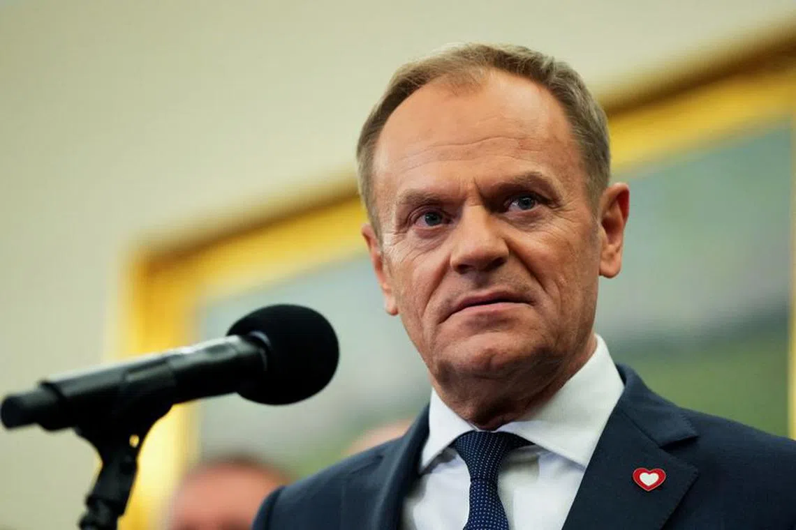 FILE PHOTO: Newly appointed Polish Prime Minister Donald Tusk speaks after winning the vote of confidence for his government, in Parliament, in Warsaw, Poland December 12, 2023. REUTERS/Aleksandra Szmigiel/File Photo