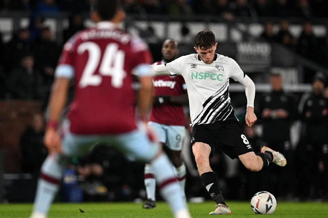 Derby County, whose midfielder Max Bird is pictured against West Ham in the FA Cup,  was on the brink of liquidation last year.