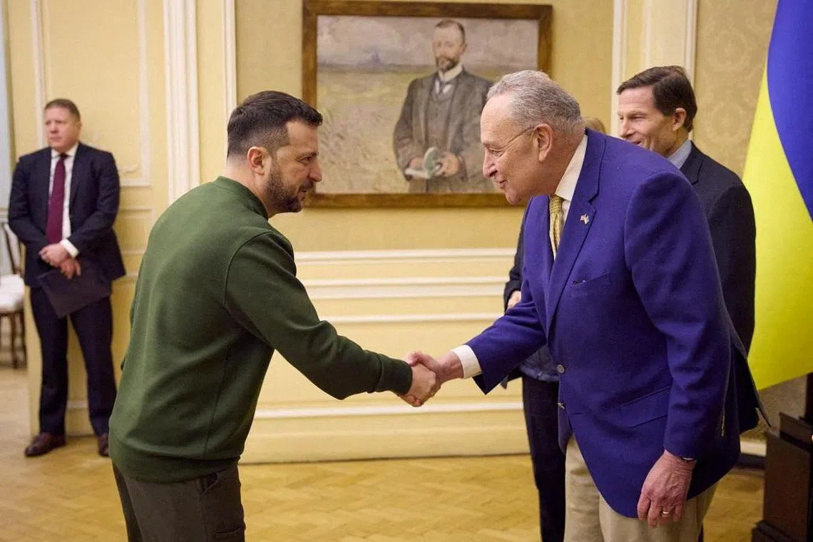 Ukrainian President Volodymyr Zelensky (left) welcomes Senate majority leader Chuck Schumer to Kyiv.