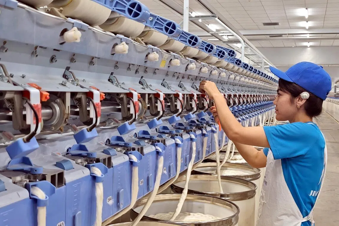 An employee at a textile factory in Awat city, Xinjiang.