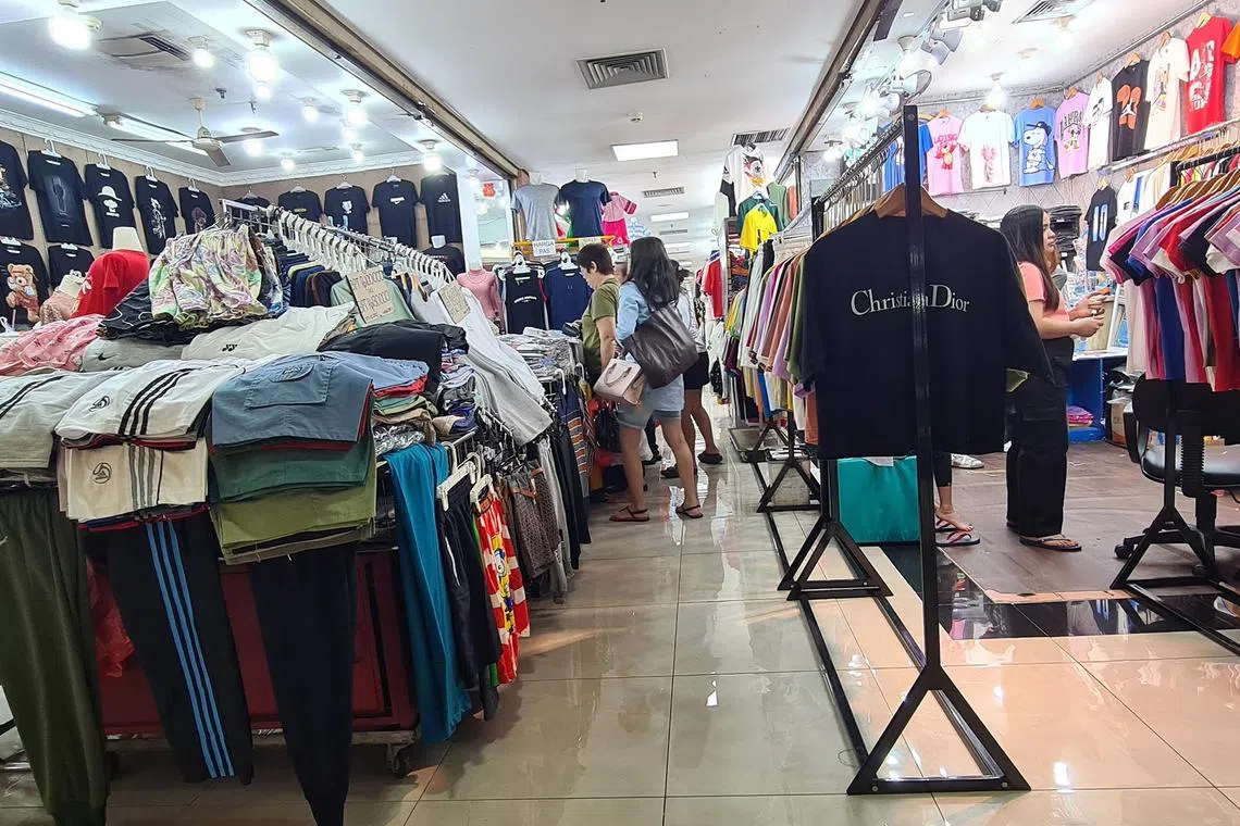 lyimport - Shoppers selecting clothes at a shopping centre in North Jakarta.

CREDIT: THE STRAITS TIMES/LINDA YULISMAN