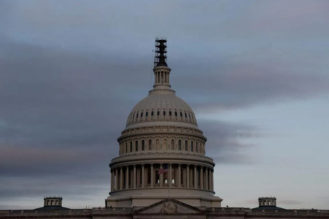 FILE PHOTO: The morning sky brightens over the U.S. Capitol, where lawmakers continue to posture and negotiate spending bills ahead of a looming U.S. government shutdown in Washington, U.S. September 28, 2023.  REUTERS/Jonathan Ernst/File Photo