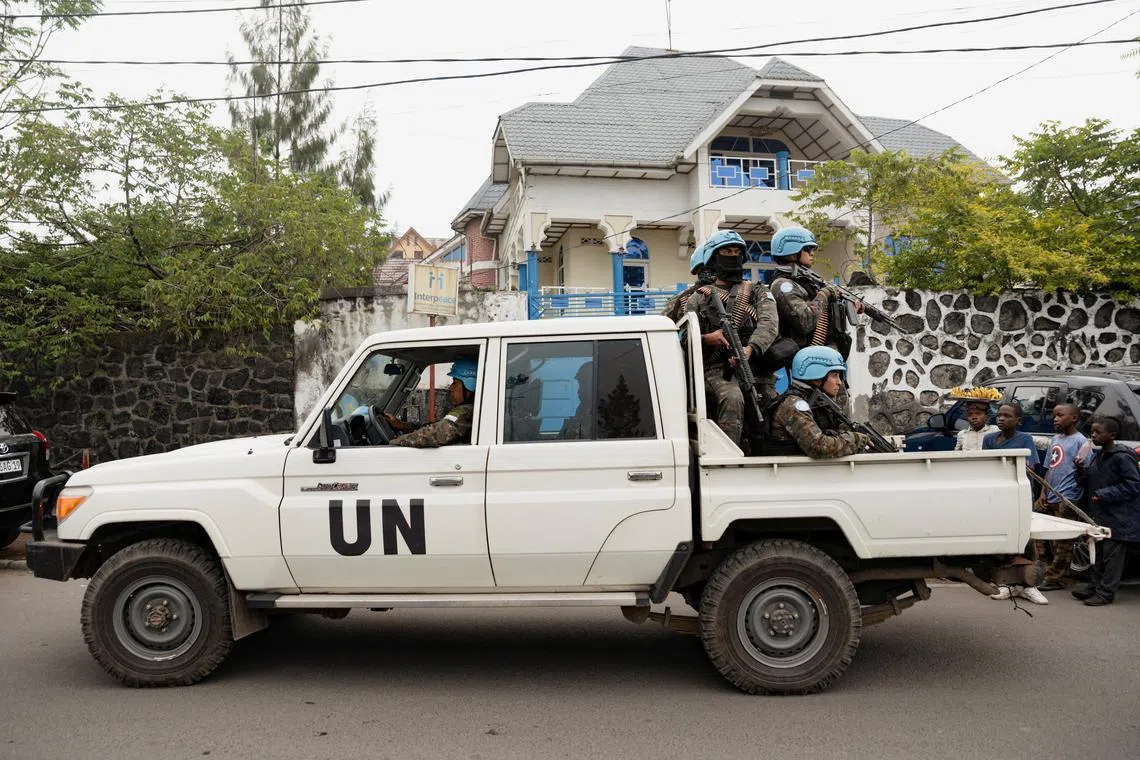 FILE PHOTO: Members of the United Nations Organization Stabilization Mission in the Democratic Republic of the Congo (MONUSCO) ride on a pickup truck as they secure the evacuation of non-essential UN staff, following the fight between M23 rebels and the Armed Forces of the Democratic Republic of the Congo (FARDC), in Goma, North Kivu province, Democratic Republic of Congo, January 25, 2025. REUTERS/Arlette Bashizi/File Photo