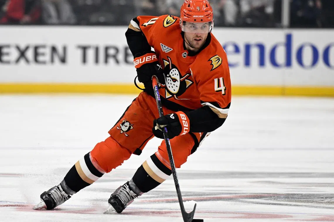 FILE PHOTO: Dec 4, 2024; Anaheim, California, USA;  Anaheim Ducks defenseman Cam Fowler (4) handles the puck during the second period against the Vegas Golden Knights at Honda Center. Mandatory Credit: Alex Gallardo-Imagn Images/File Photo