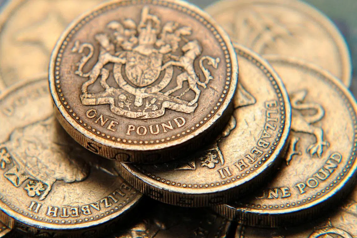 A pile of one pound coins is seen, in central London June 17, 2008.   REUTERS/Toby Melville (BRITAIN)/File Photo