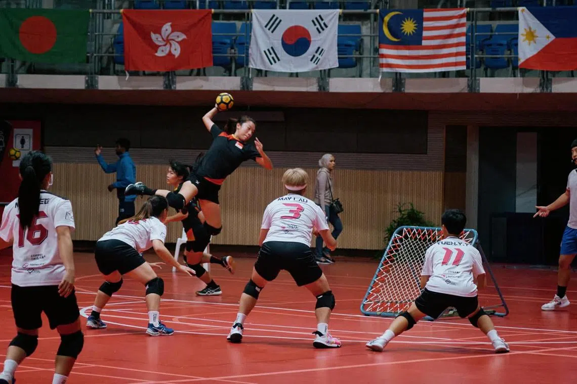 Singapore's Liaw Li Qing (holding ball) in action during the 2022 Asia Pacific Tchoukball Championships.