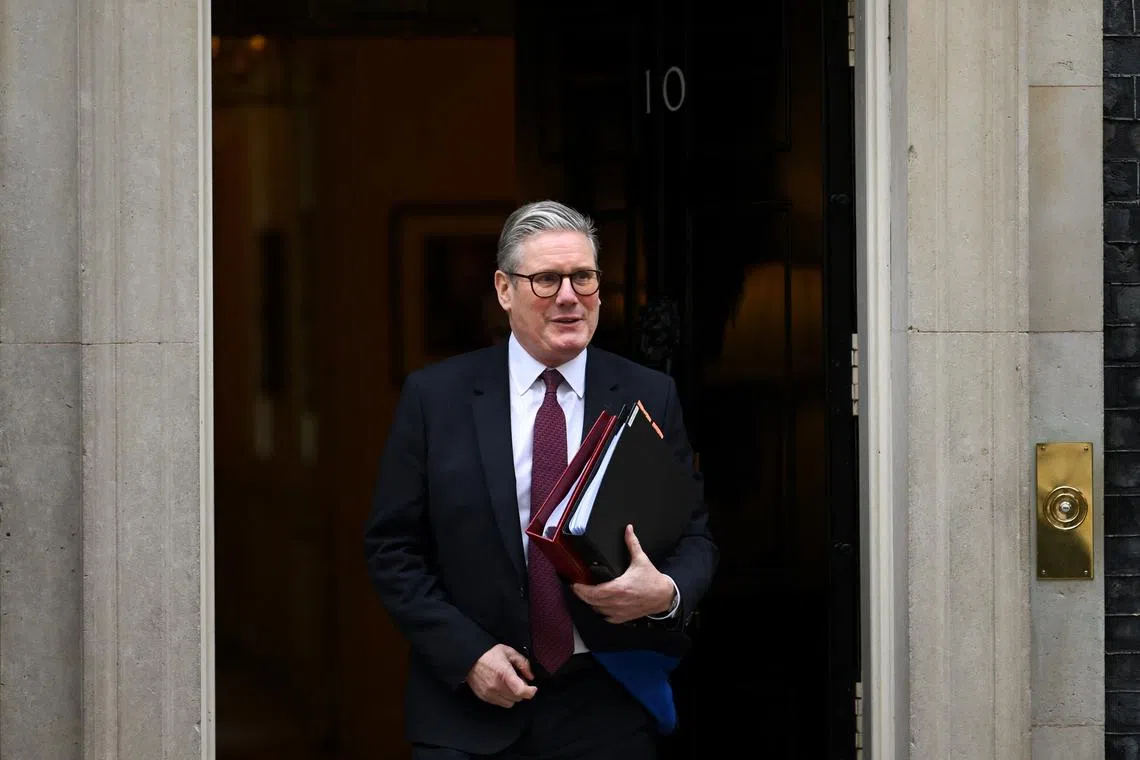 FILE PHOTO: British Prime Minister Keir Starmer walks outside 10 Downing Street in London, Britain, February 12, 2025. REUTERS/Jaimi Joy/File Photo