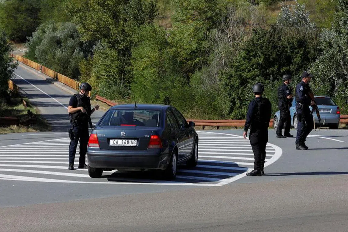FILE PHOTO: Kosovo police officers patrol a road to Banjska monastery, in the aftermath of a shooting incident, near Zvecan, Kosovo September 26, 2023. REUTERS/Ognen Teofilovski/File Photo