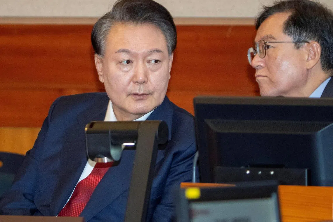 FILE PHOTO: South Korea's impeached President Yoon Suk Yeol attends the hearing of his impeachment trial over his short-lived imposition of martial law, at the Constitutional Court in Seoul, South Korea, February 20, 2025.    SONG KYUNG-SEOK/Pool via REUTERS/File Photo