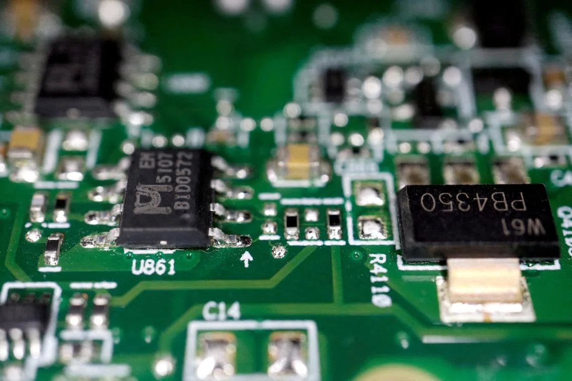 FILE PHOTO: Semiconductors are seen on a printed circuit board in this illustration picture taken February 17, 2023. REUTERS/Florence Lo/Illustration/File Photo