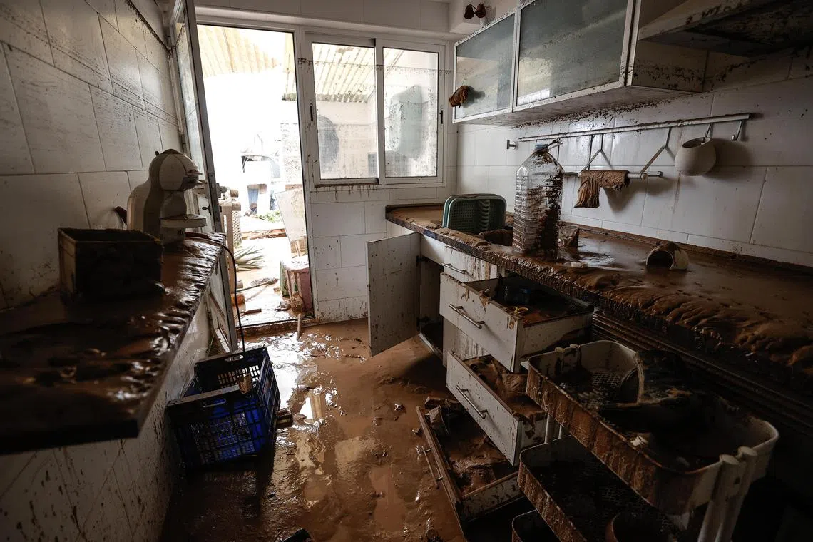 Damaged furniture inside in a flooded home in the flood-hit municipality of Paiporta, in the province of Valencia, Spain, on Oct 30. 