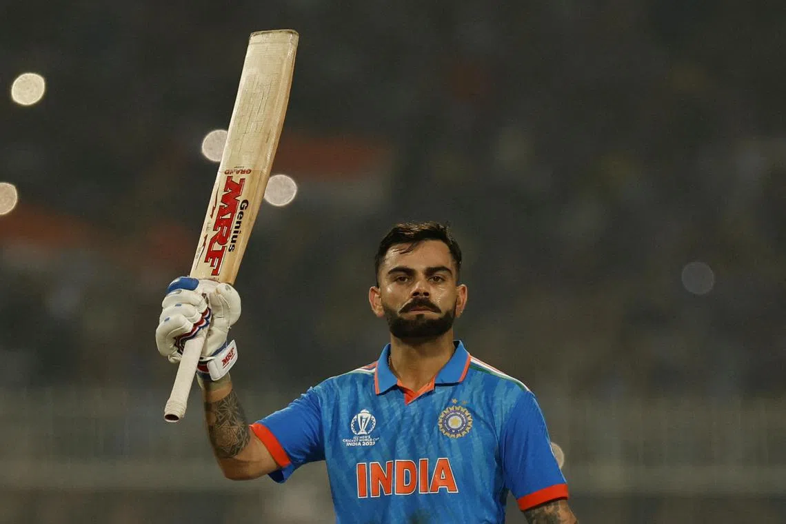 India's Virat Kohli celebrating after reaching his 49th century, equalising with Sachin Tendulkar's record of most number of ODI centuries.