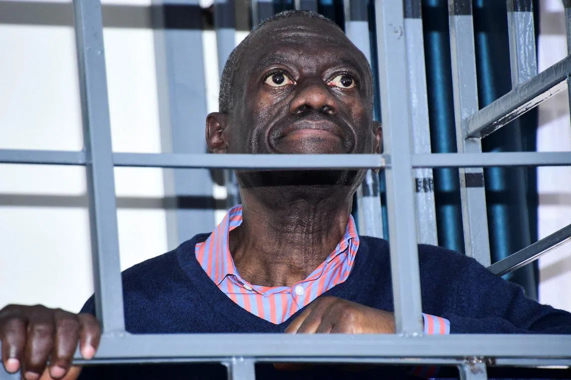 FILE PHOTO: Opposition leader Kizza Besigye stands in a steel dock at the Uganda Military General Court Martial in Makindye, a suburb of Kampala, Uganda December 2, 2024. REUTERS Abubaker Lubowa/File Photo