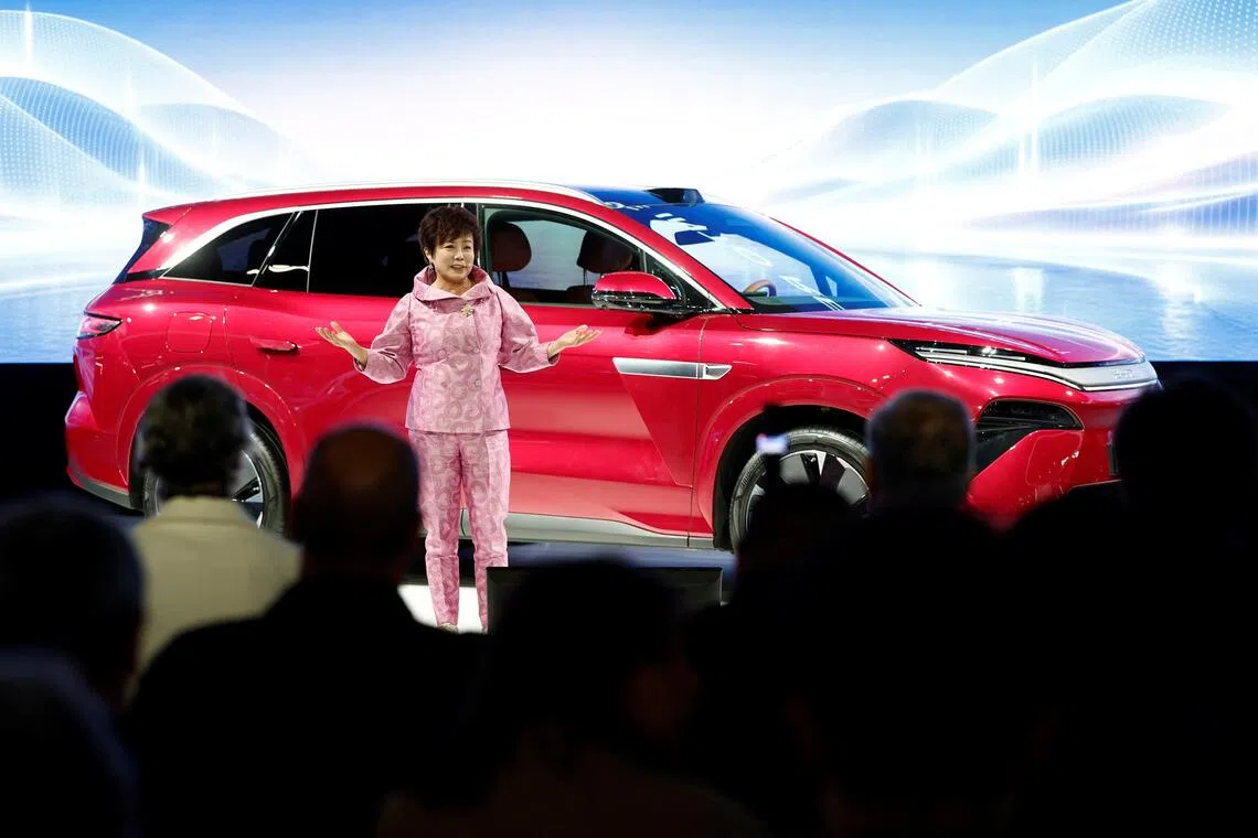 Stella Li, Executive Vice President of BYD, speaks during a press conference on media day at the 2026 Paris Auto Show in Paris, France, on Oct 12.