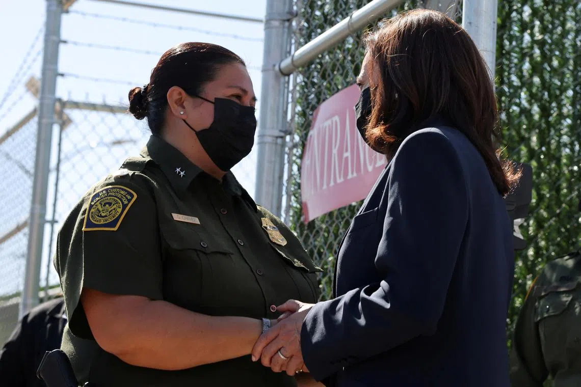 FILE PHOTO: U.S. Vice President Kamala Harris speaks with Gloria Chavez, Chief Patrol Agent of the El Paso Sector, as she visits El Paso central processing center in El Paso, Texas, U.S., June 25, 2021. REUTERS/Evelyn Hockstein/File Photo