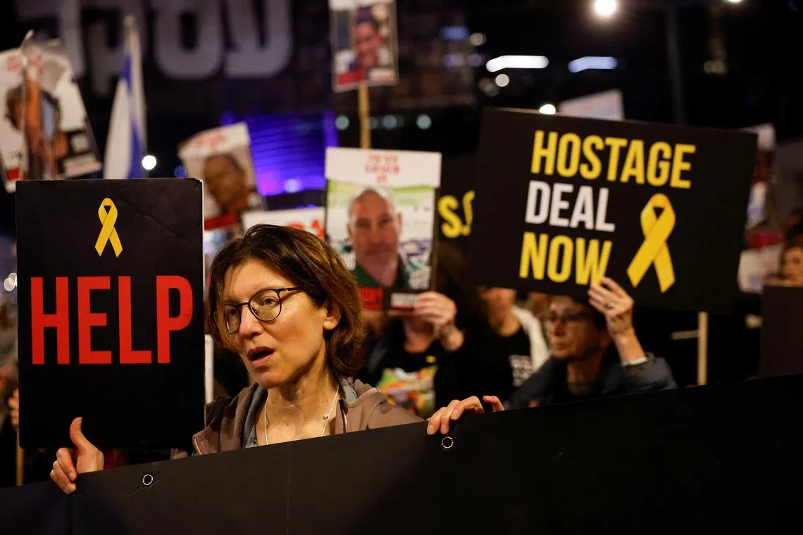 Demonstrators attend a protest against Israeli Prime Minister Benjamin Netanyahu's government and call for the release of hostages kidnapped in the deadly October 7 attack on Israel by the Palestinian Islamist group Hamas from Gaza, in Tel Aviv, Israel, March 23, 2024. REUTERS/Carlos Garcia Rawlins