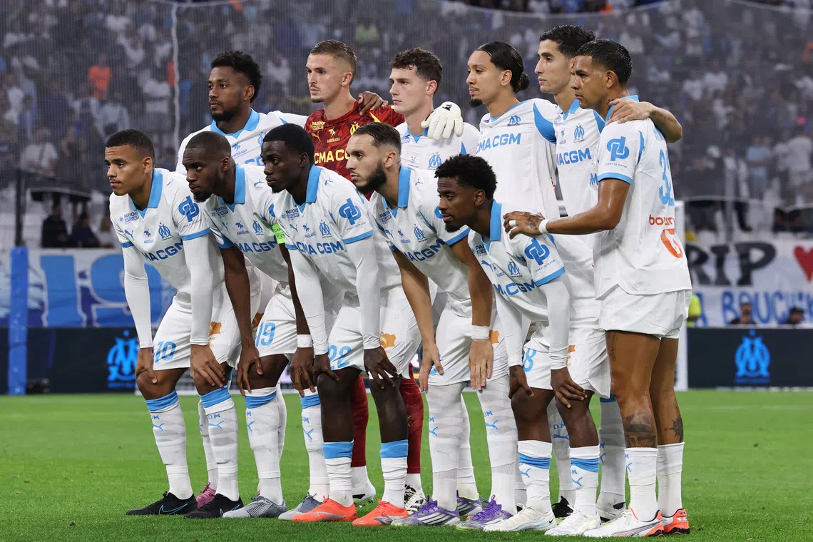 FILE PHOTO: Soccer Football - Ligue 1 - Olympique de Marseille v FC Lorient - Orange Velodrome, Marseille, France - September 12, 2025 Olympique de Marseille players pose for a team group photo before the match REUTERS/Manon Cruz/File Photo