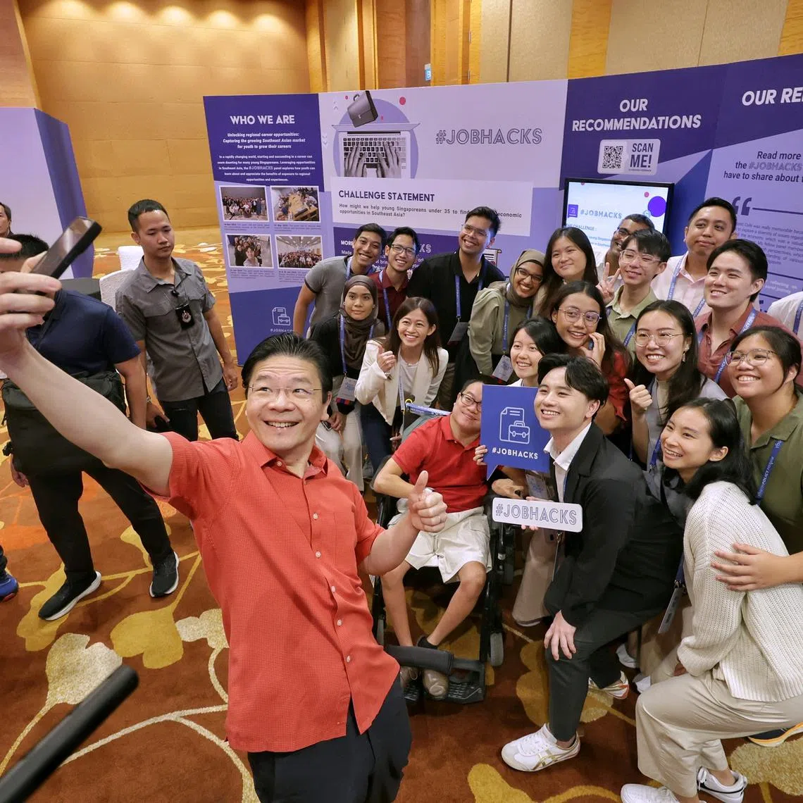 Prime Minister Lawrence Wong taking a wefie with students and young working adults at the inaugural Youth Policy Forum on Aug 24, 2024.