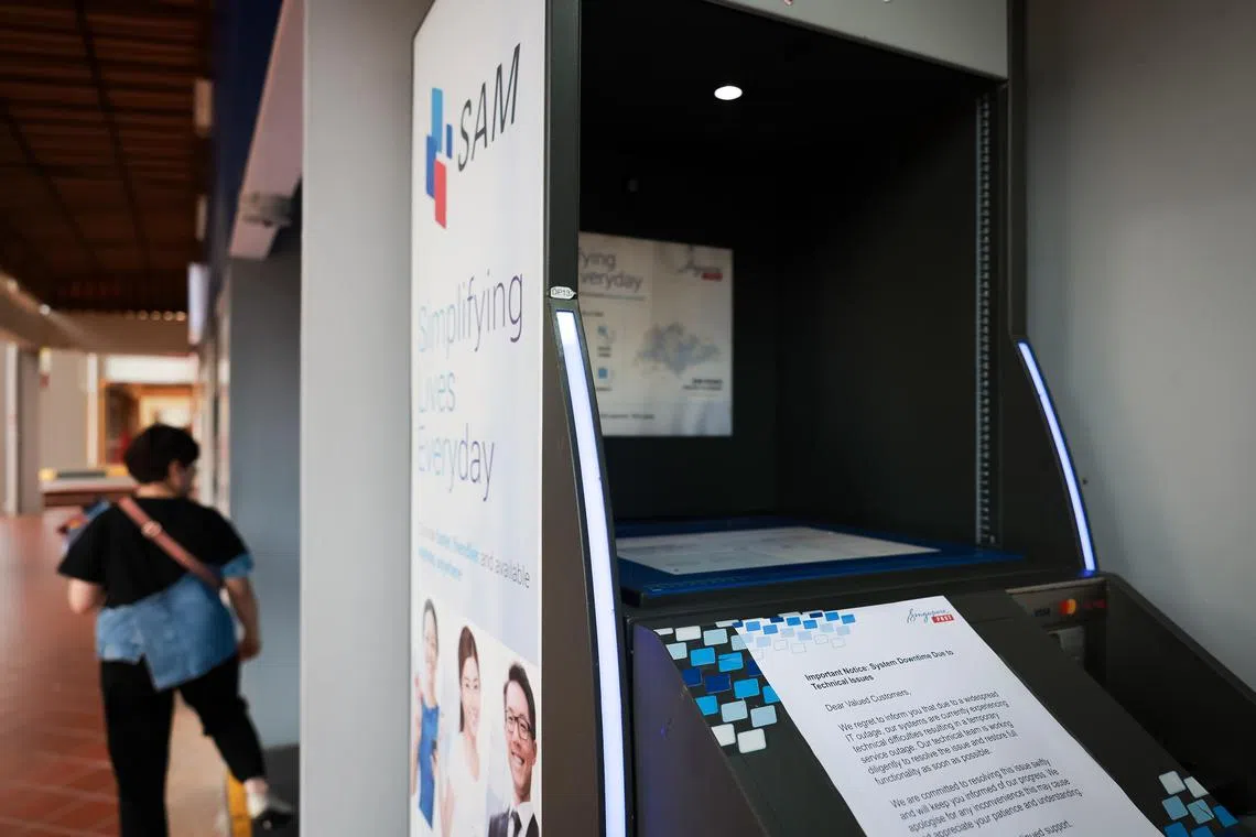 A notice on a SingPost SAM machine at block 165 Bukit Merah Central stating that the system is down due to a widespread IT outage on July 19, 2024.