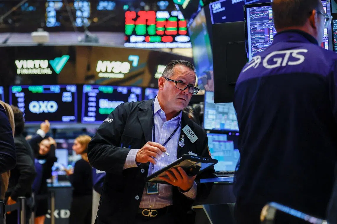Traders working on the floor of the New York Stock Exchange, in New York City, on Sept 29.