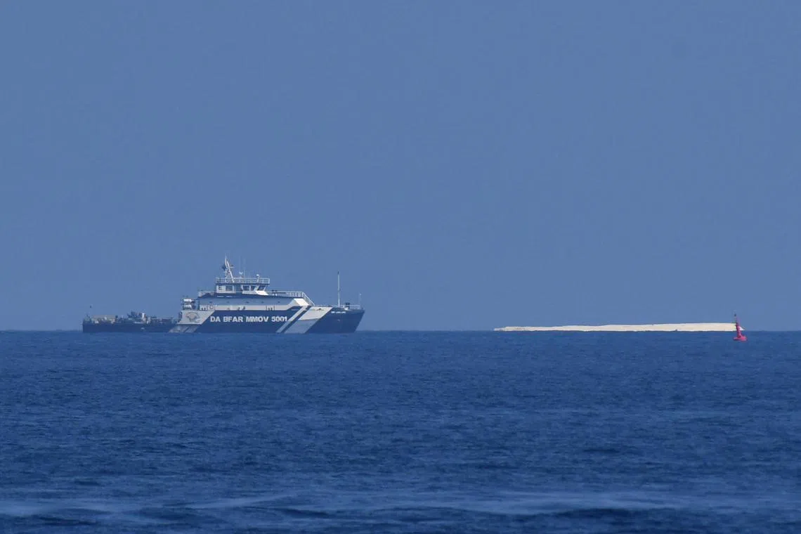 The scientific team spent four hours at two reefs and was able to complete its mission, despite the presence of Chinese vessels and a Chinese military helicopter circling overhead. 