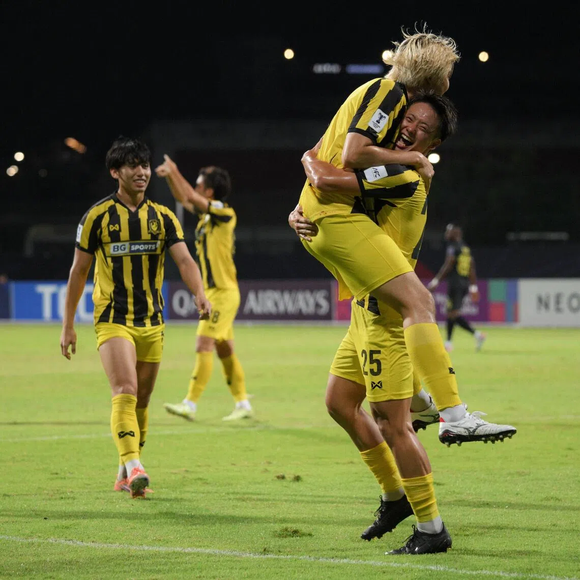Hide Higashikawa (right) of Tampines Rovers FC celebrating with Seiga Sumi after scoring against Kaya-Iloilo during the AFC Champions League Two match with Glenn Kweh watching on.