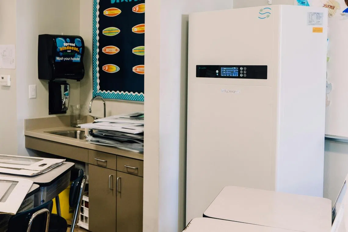 An air purifier uses a fan to draw air from a room through one or more filters, before releasing the clean air into the space.
