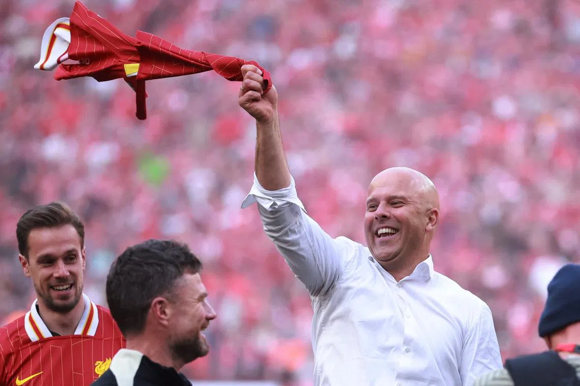 Soccer Football - Premier League - Liverpool v Tottenham Hotspur - Anfield, Liverpool, Britain - April 27, 2025 Liverpool manager Arne Slot celebrates after winning the Premier League REUTERS/Phil Noble