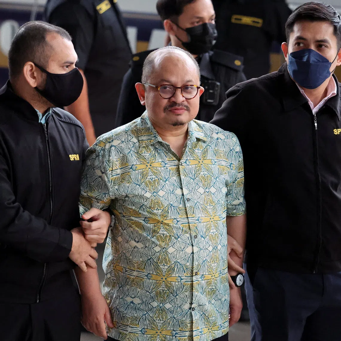 Shamsul Iskandar Mohd Akin, former senior political secretary to Prime Minister Anwar Ibrahim, is taken to Kuala Lumpur Court Complex by Malaysian Anti-Corruption Commission officers as he is expected to be charged over bribery allegations, in Kuala Lumpur, Malaysia, December 4, 2025. REUTERS/Hasnoor Hussain